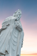 Fototapeta premium Lady Buddha statue on the sunrise. Danang Vietnam.