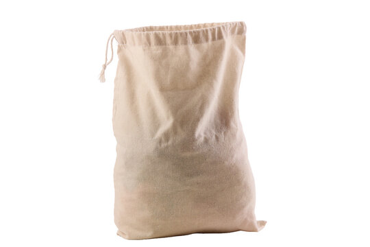 Natural linen sack sits on plain white surface