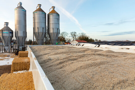 Large silos at farm against sky