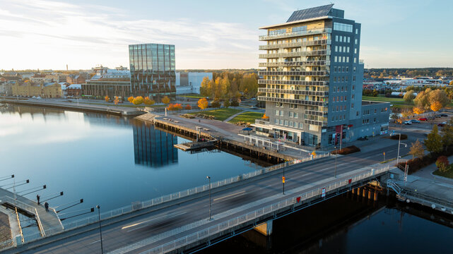 Drone view of bridge over river in modern city
