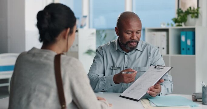 Doctor, patient and conversation with clipboard, wellness survey or health insurance form in office. Healthcare worker, people and discussion with checklist, medical aid advice or policy registration