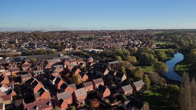 Aerial View of Thrapston Town Rooftops with River Nene and Bridge in Northamptonshire England