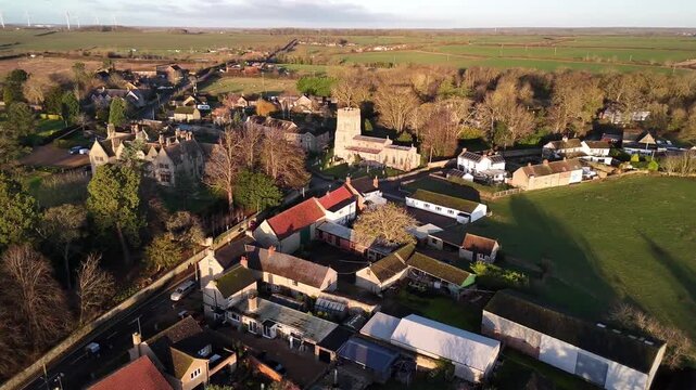 Aerial View of Village Church Tower and Stone Buildings in Great Addington Northamptonshire England