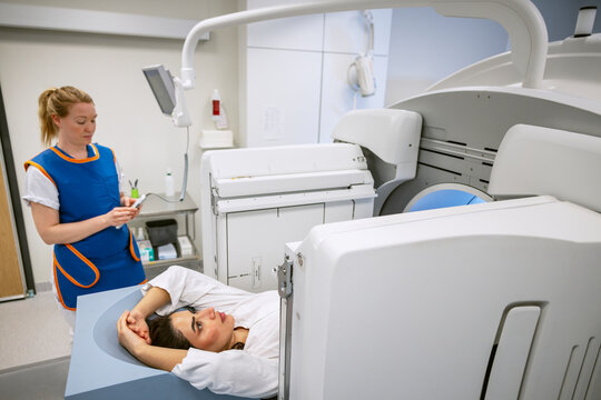 Female patient undergoing through MRI scan examination at clinic