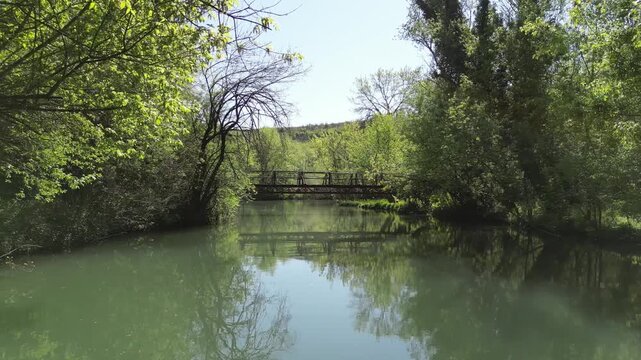 Drone Approaching Wooden Bridge Over River at Iskar Panega Trail