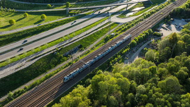 Aerial view of train on railroad track amidst greenery at rural location
