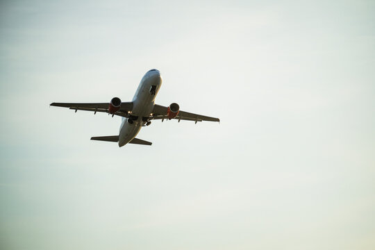 Scenic view of passenger jet airplane flying high in sky