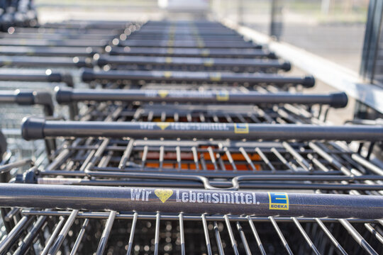Bad Hersfeld, Germany, 04.29.2026: Empty carts at store entrance, edeka
