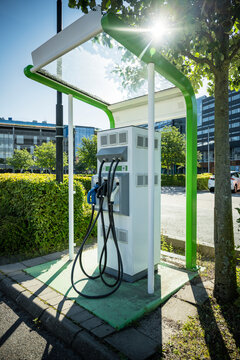 Fuel pumps at gas station in street on sunny day