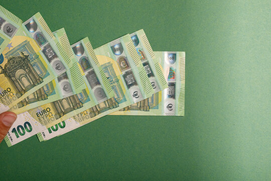 Close up view of euro currency notes fanned out in a hand, symbolizing finance