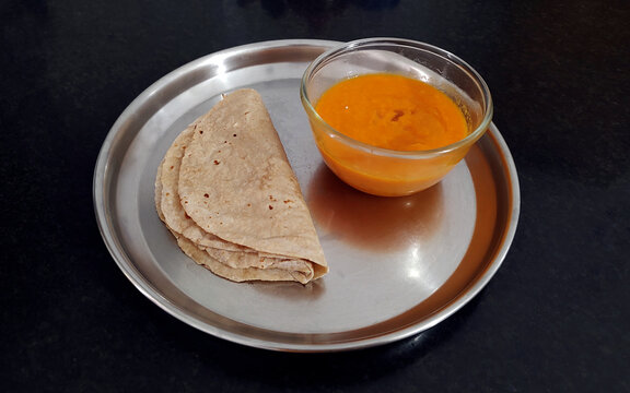 Aamras and chapati a summer holiday delicious sweet for Lunch and Dinner