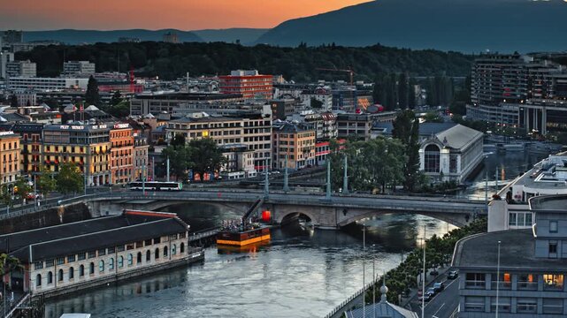 Aerial Twilight View of Geneva Cityscape and Rhone River Bridges