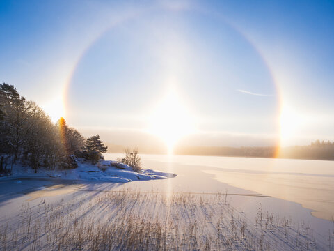 Idyllic scene of solar halo seen at beach during winter