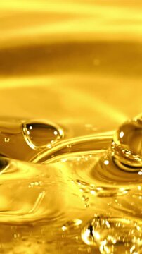Olive oil pours with splashes. The texture of olive oil. Filmed on a high-speed camera at 1000 fps. 