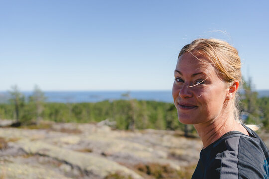 Portrait of blond beautiful woman enjoying weekend travel at remote location