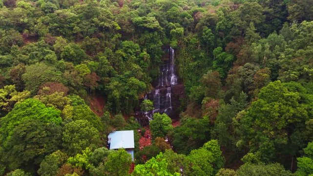 Jhari Waterfall with forest and steep rocks at Attigundi, Dattatreya Peeta, Chikkamagaluru, Karnataka, india. day time, push in shot, drone shot, 4k.