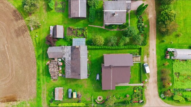 Top down, Biksti village in Dobele municipality with rural homes and fields