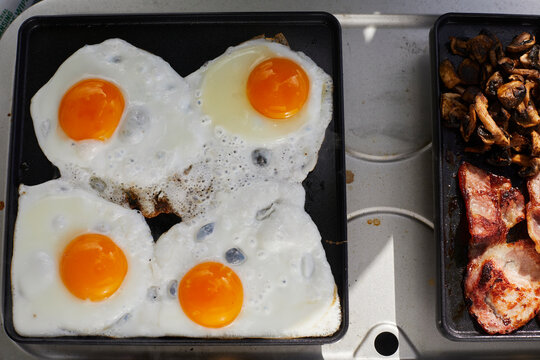 Close-up shot of sunny side up fried egg on pan