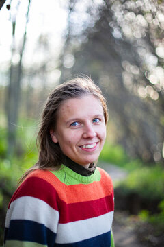 Portrait of smiling woman in striped sweater