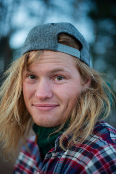 Portrait of man with blond hair wearing cap