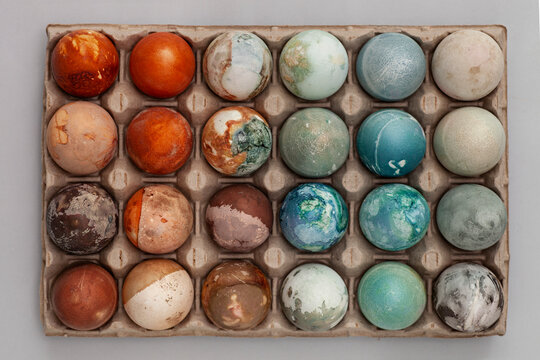 Directly above shot of painted Easter Eggs arranged in tray