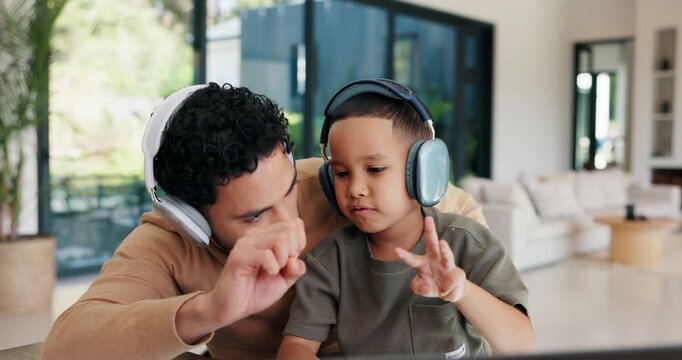 kid, father and laptop in home for counting, numbers and math with online learning. Teaching, headphones and family or man helping child with homework, homeschool and remote education for development