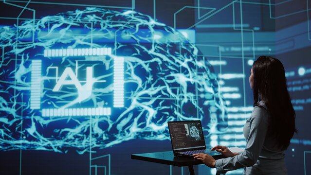 AI computer scientist using laptop for business data analysis in high tech workspace