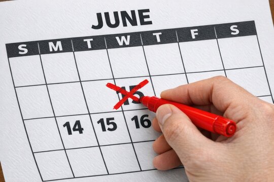 Person marking dates on a calendar, a simple and effective way to keep track of appointments and events