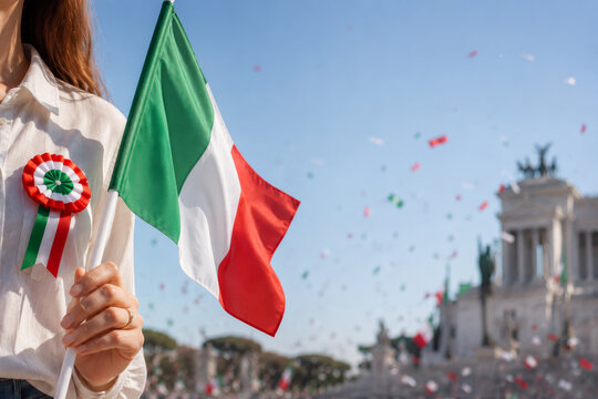 Woman holding Italian flag with tricolor rosette during Republic Day celebration in Rome with confetti.