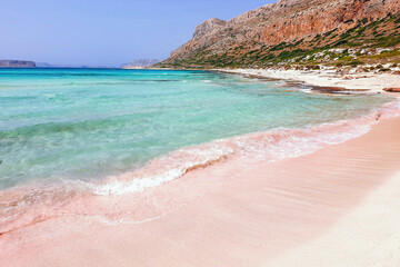 pink sand and crystal turquouise blue waters at Balos Beach at the famous Balos Lagoon in Crete Island, Greece © Aegoplaces