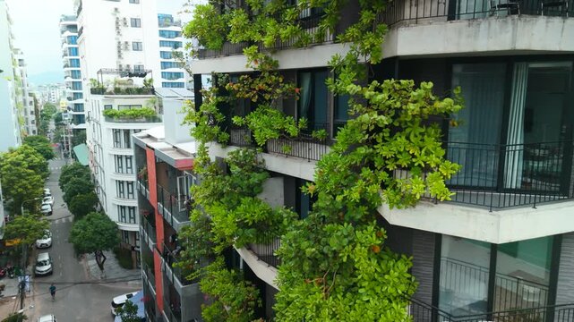 Residential building featuring extensive vertical gardens and green terraces, integrating nature into urban architecture and promoting a sustainable city lifestyle