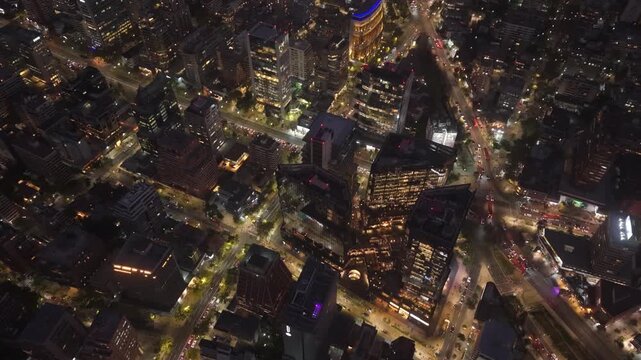 Night Aerial Dolly In of Mercado Urbano Tobalaba and El Golf District Santiago Chile