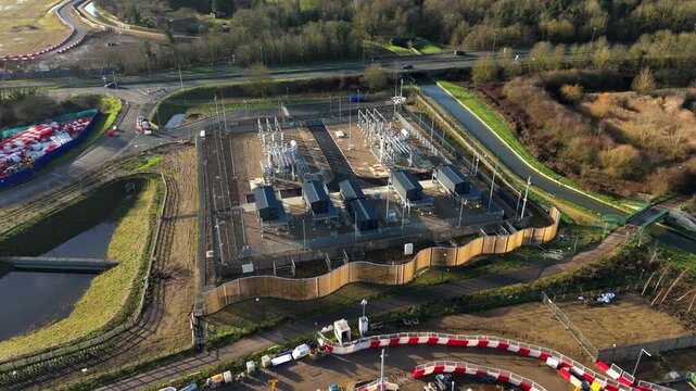 Aerial view of a major electrical substation and high-voltage transmission network, UK.