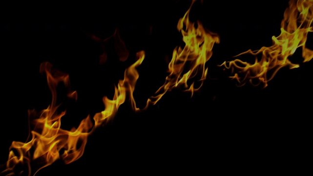 A diagonal stream of intense fire burns and flickers against a solid black background.