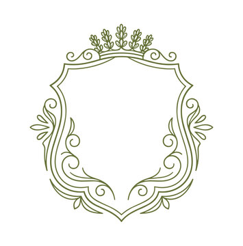 Decorative shield frame with intricate floral and scrollwork
