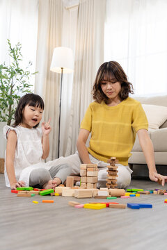 Family activity bonding relationship, happy children play and learn, child development, homeschool education, girl create wooden toy block, building intelligence knowledge and emotional quotient