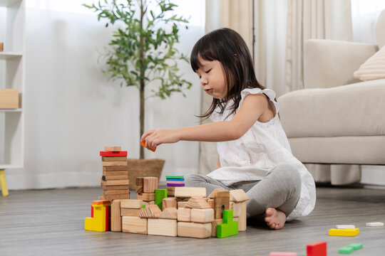 education, child, learning, development, play, family, cognitive, problem solving, parenting, brain young girl building tower with blocks, creative play improves coordination and early learning skills