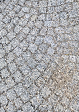 ​Blue granite cobblestone pavement texture background, traditional stone walkway with arched pattern