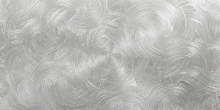 Brushed metal texture with a circular pattern, creating a sophisticated and industrial background for design.