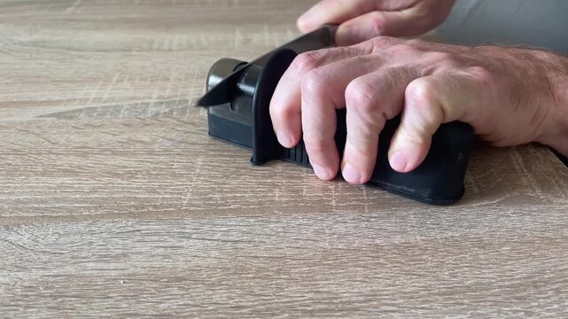 knife sharpener grinds and scrapes when sharping a steel knife