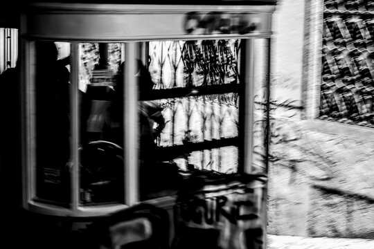 Lisbon, Portugal - 11 August 2018 - Abstract black and white motion blur of urban storefront and street textures