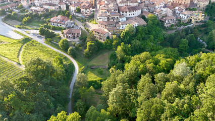 Fototapeta premium Aerial View of Barolo Village and Lush Green Forest in Piedmont Italy