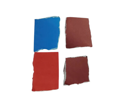 Torn paper squares in red blue and brown isolated on black