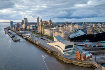 Obraz premium Liverpool, England. aerial view of Pier Head with the Three Graces including the Royal Liver Building and Port of Liverpool Building beside the River Mersey waterfront.
