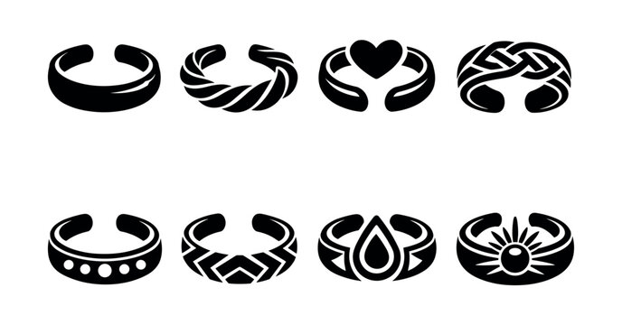 Collection of eight unique black toe ring designs on a white background