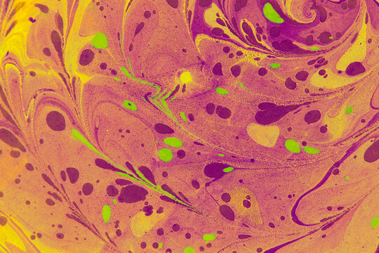 Avant-garde purple and orange marbled paper, bold editorial background texture