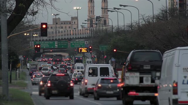 Dusk Traffic Flow in Downtown Buenos Aires with City Lights - 4K