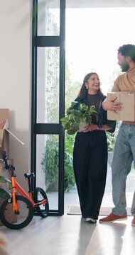 Family, moving in and running in new home, open door and excited for property investment with kids. Happy mother, father and relocation together with children, real estate or plant box in dream house