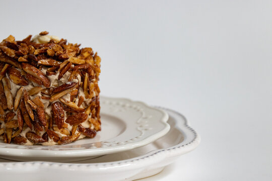Close-up of Caramelized Almond Croquant Cake on Elegant Plates