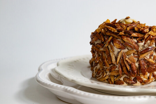 Close-up of Caramelized Almond Croquant Cake on Elegant Plates
